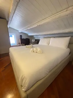 Letto o letti in una camera di VicomilleSuites Cagliari Adults-Only