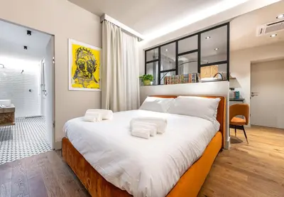 Letto o letti in una camera di VicomilleSuites Cagliari Adults-Only