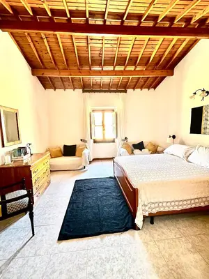 Letto o letti in una camera di Casa Veronica - accogliente casa su due piani nel cuore del borgo