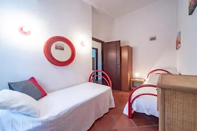 Letto o letti in una camera di Villa Alessia