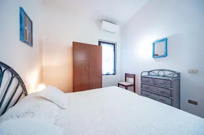 Letto o letti in una camera di Villa Alessia