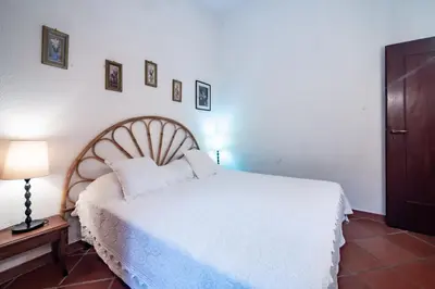 Letto o letti in una camera di Villa Alessia