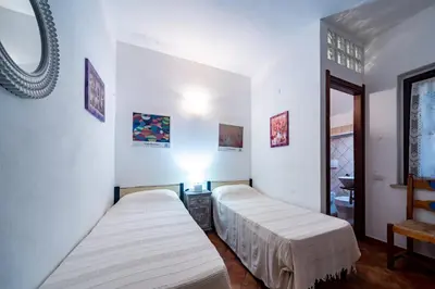 Letto o letti in una camera di Villa Nicola