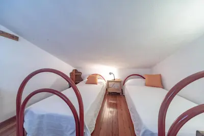 Letto o letti in una camera di Villa Maria Lina
