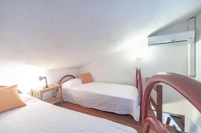 Letto o letti in una camera di Villa Maria Lina