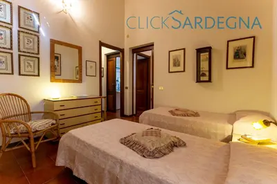 Letto o letti in una camera di Villa right on the beach a Santa Margherita di Pula for 12 people