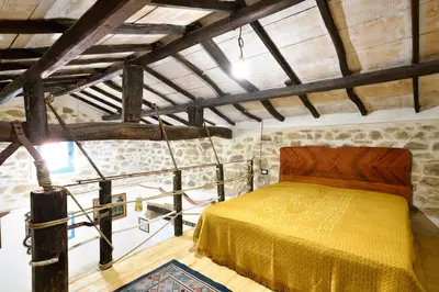 Letto o letti in una camera di La Pergola