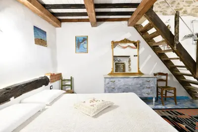Letto o letti in una camera di La Pergola