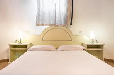 Letto o letti in una camera di bilocale Pinewood