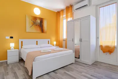 Letto o letti in una camera di Iris Rooms