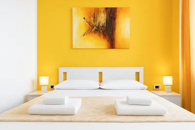 Letto o letti in una camera di Iris Rooms