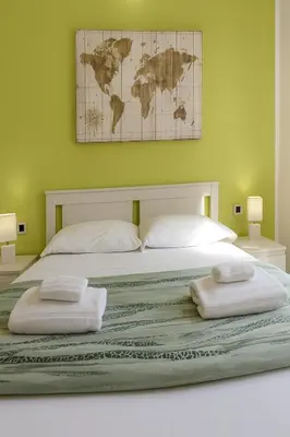 Letto o letti in una camera di Iris Rooms