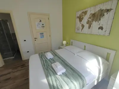 Letto o letti in una camera di Iris Rooms