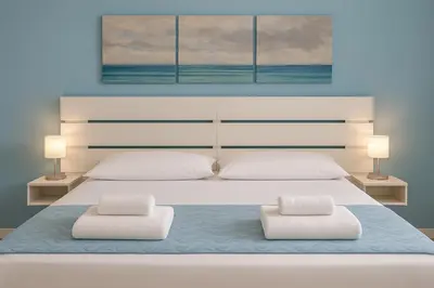 Letto o letti in una camera di Iris Rooms