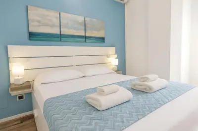 Letto o letti in una camera di Iris Rooms