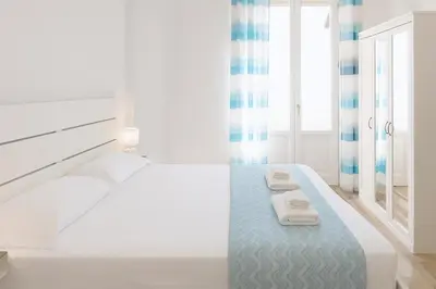 Letto o letti in una camera di Iris Rooms