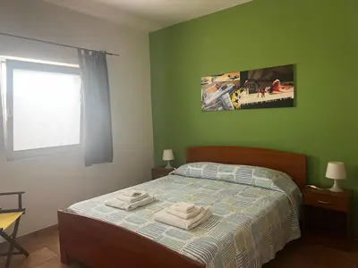 Letto o letti in una camera di LE SALINE: beautiful apartment with terrace and splendid view