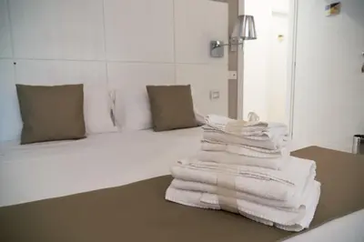 Letto o letti in una camera di Rigel Villanova Rooms