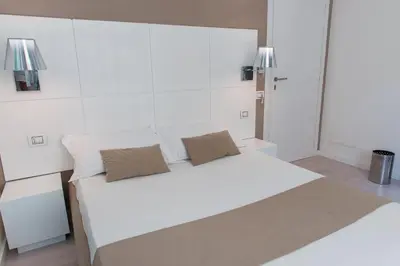 Letto o letti in una camera di Rigel Villanova Rooms