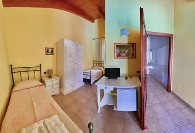 Letto o letti in una camera di Su Massaiu