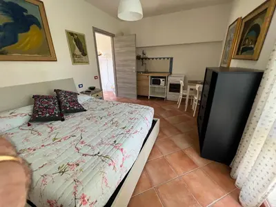 Letto o letti in una camera di L’ESSENZIALE