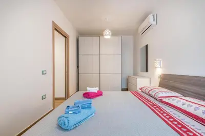 Letto o letti in una camera di Casa Sofia