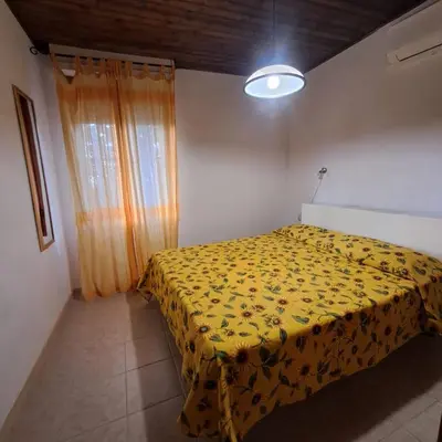 Letto o letti in una camera di Casa spiaggia di Solanas 3