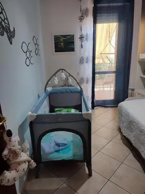 Letto o letti in una camera di Rami di Corallo Appartamento con Parcheggio Privato ----------