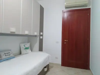 Letto o letti in una camera di Rami di Corallo Appartamento con Parcheggio Privato ----------