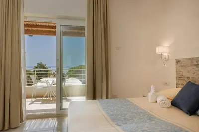 Letto o letti in una camera di Mercury Beach Hotel
