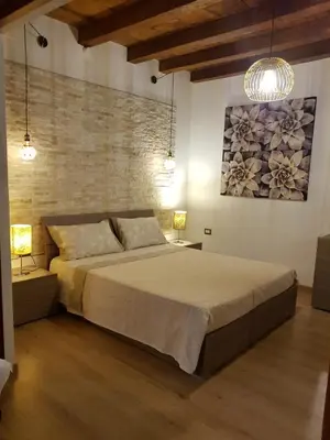 Letto o letti in una camera di Casa Virginia Antica Iglesias di Silvana