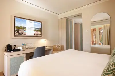 Letto o letti in una camera di Almar Timi Ama Villasimius Resort & Spa