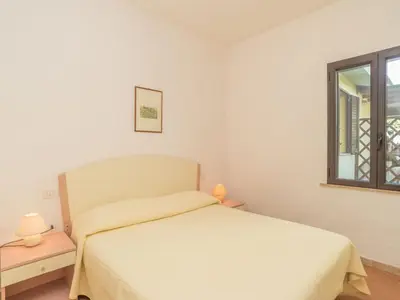 Letto o letti in una camera di Apartment Stella con piscina comune - REI101 by Interhome