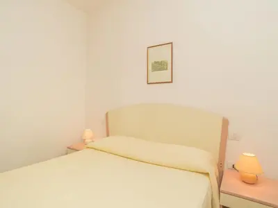 Letto o letti in una camera di Apartment Stella con piscina comune - REI101 by Interhome