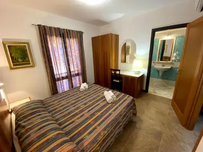 Letto o letti in una camera di Villa Silvana