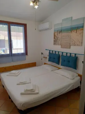 Letto o letti in una camera di Casa Ondina