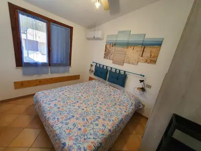 Letto o letti in una camera di Casa Ondina