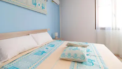 Letto o letti in una camera di Il Lentischio Home