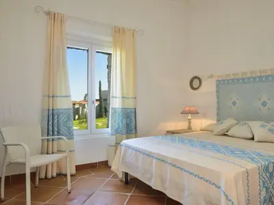 Letto o letti in una camera di Case Li Conchi Sardegna C