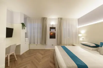 Letto o letti in una camera di Hotel Baylle