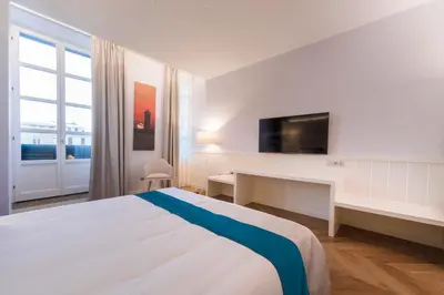 Letto o letti in una camera di Hotel Baylle