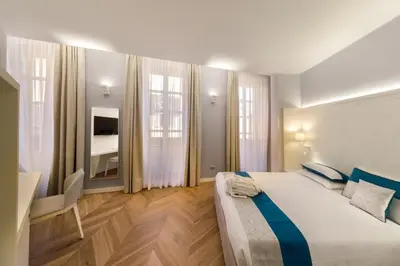Letto o letti in una camera di Hotel Baylle
