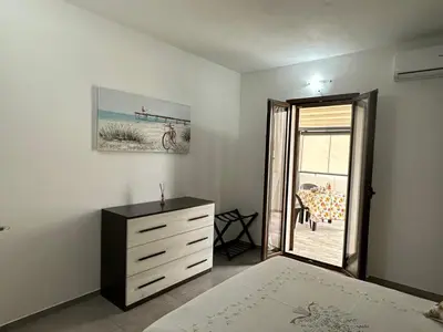 Letto o letti in una camera di Diletta Apartment Casa Vacanze a Tortolì a 300m dal Mare con WiFi e Parcheggio Gratuito in strada
