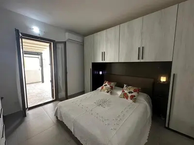Letto o letti in una camera di Diletta Apartment Casa Vacanze a Tortolì a 300m dal Mare con WiFi e Parcheggio Gratuito in strada