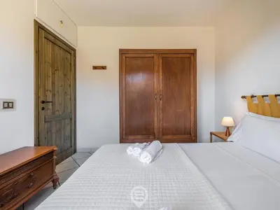 Letto o letti in una camera di Villa Maria Luisa