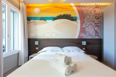 Letto o letti in una camera di ARKADIA Rooms & Apartments