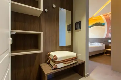 Letto o letti in una camera di ARKADIA Rooms & Apartments