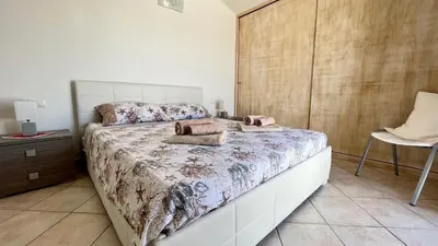 Letto o letti in una camera di Attici con Terrazzo vista Mare