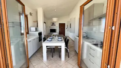 Cucina o angolo cottura di Attici con Terrazzo vista Mare