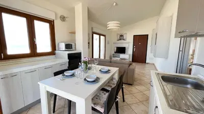 Cucina o angolo cottura di Attici con Terrazzo vista Mare